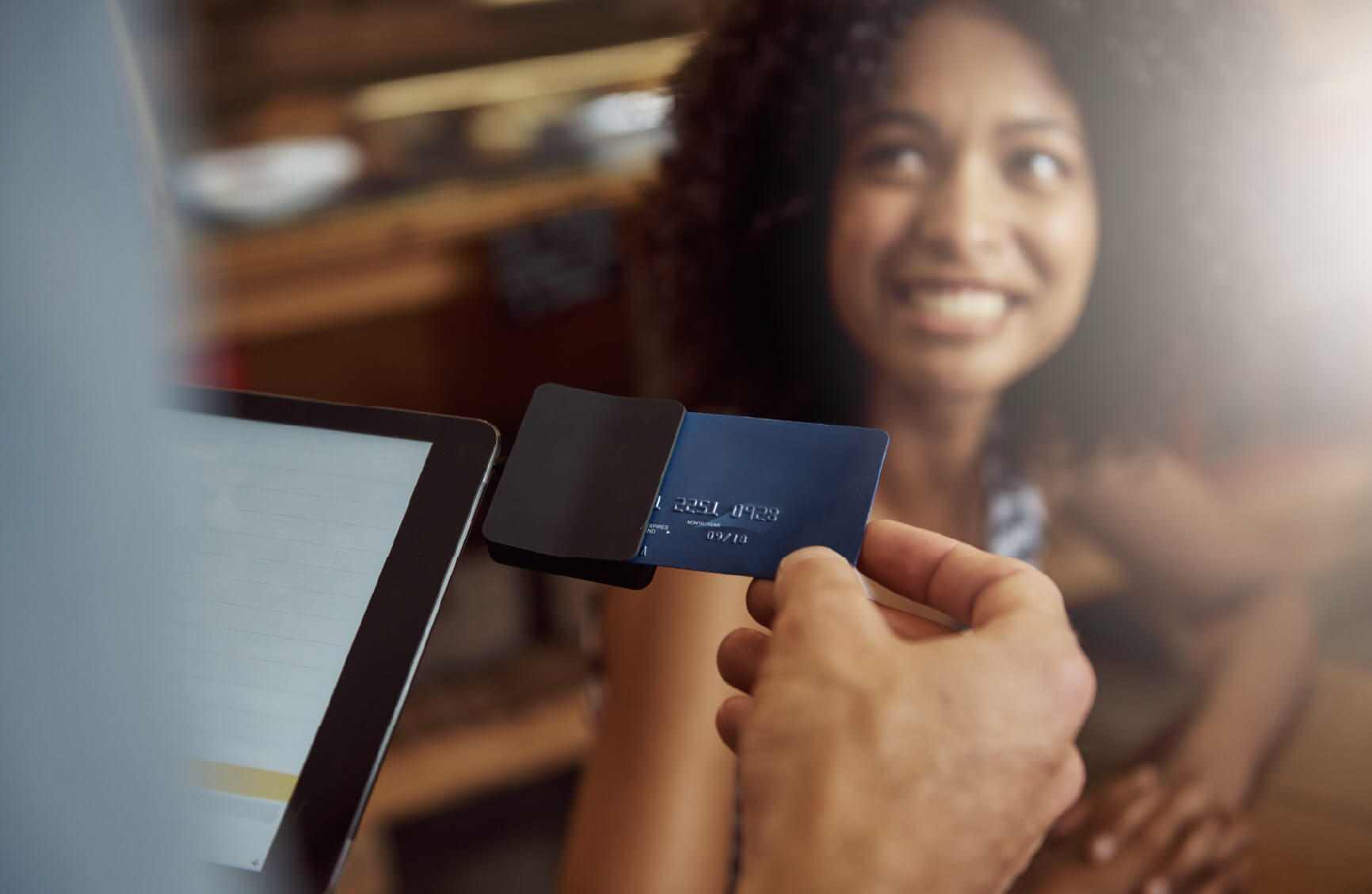 Woman paying with a credit card